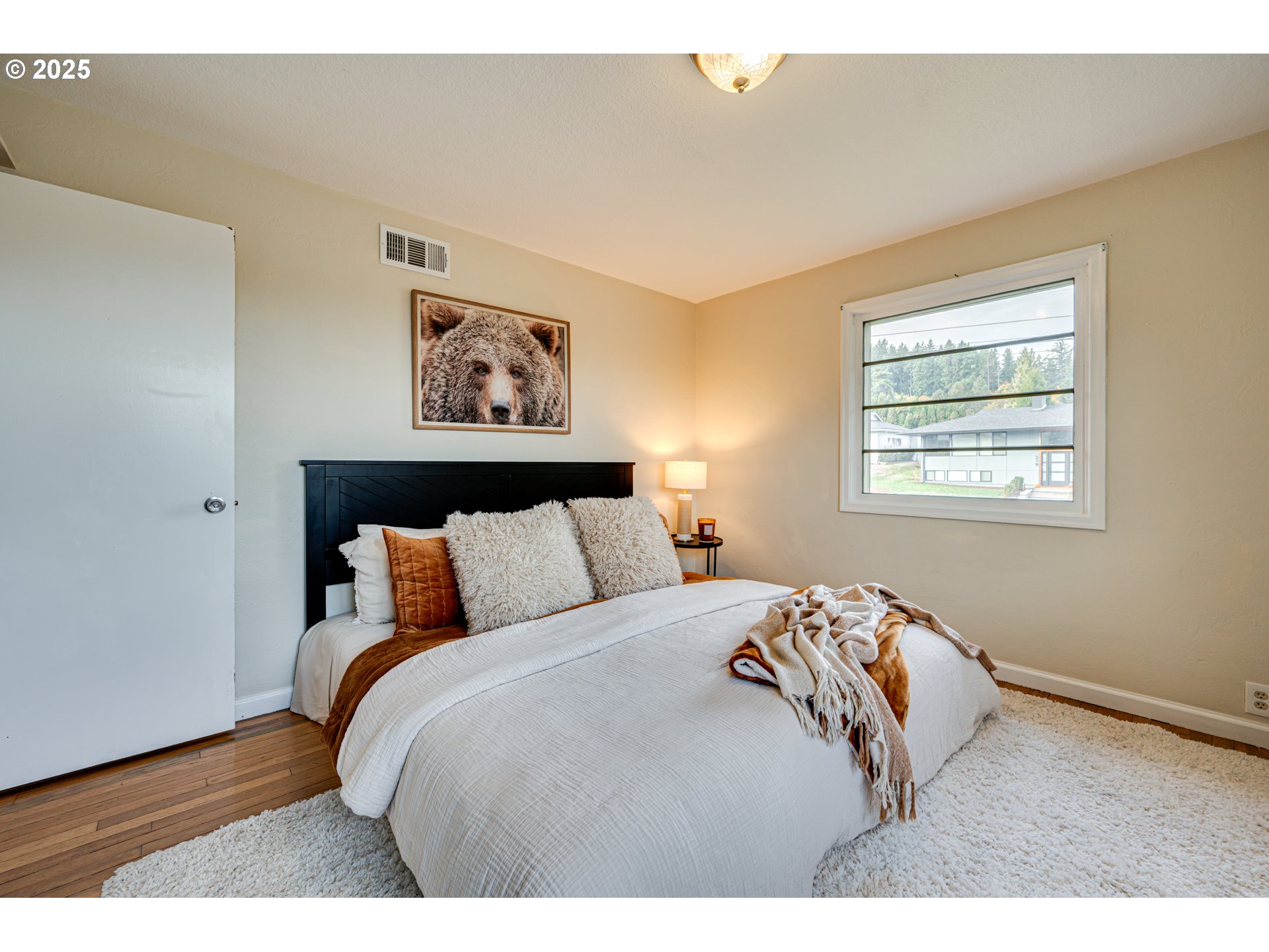 222 Northwest 19th Avenue Camas, WA 98607 - Photo 16 of 42 a bedroom with a bed and a painting on the wall