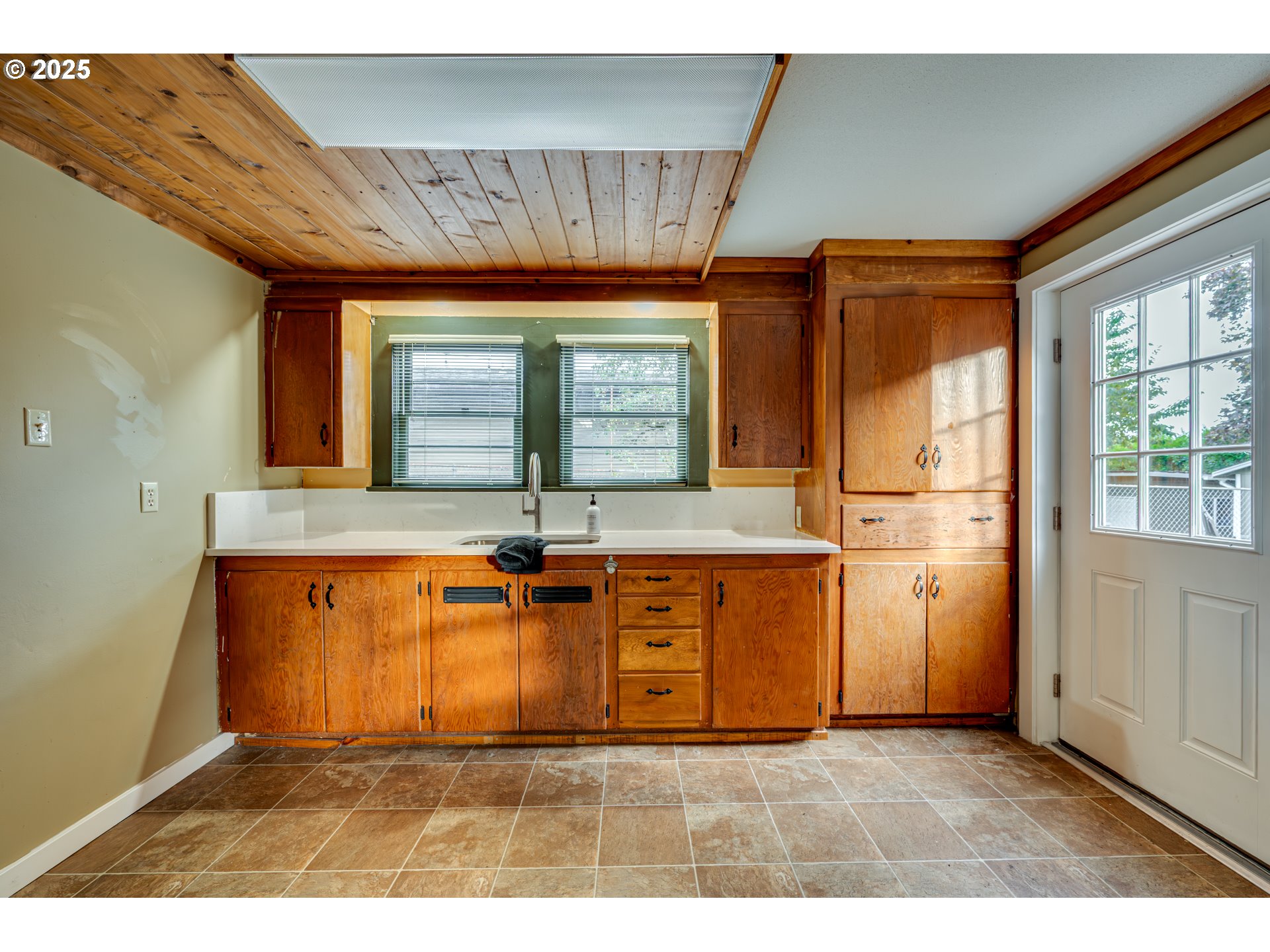 222 Northwest 19th Avenue Camas, WA 98607 - Photo 24 of 42 a view of a kitchen with wooden floor and a large window