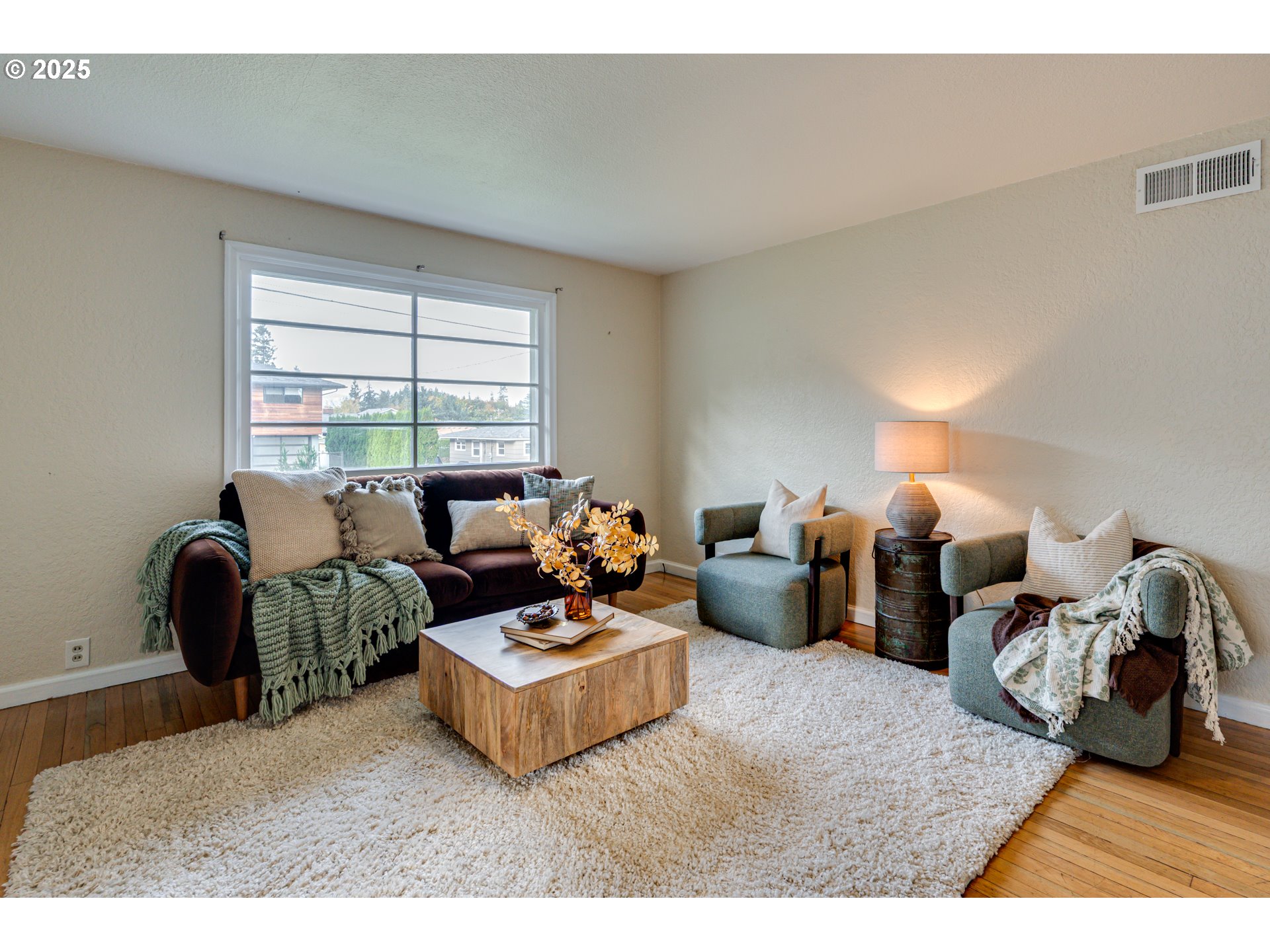 222 Northwest 19th Avenue Camas, WA 98607 - Photo 7 of 42 a living room with furniture a couch and two large window