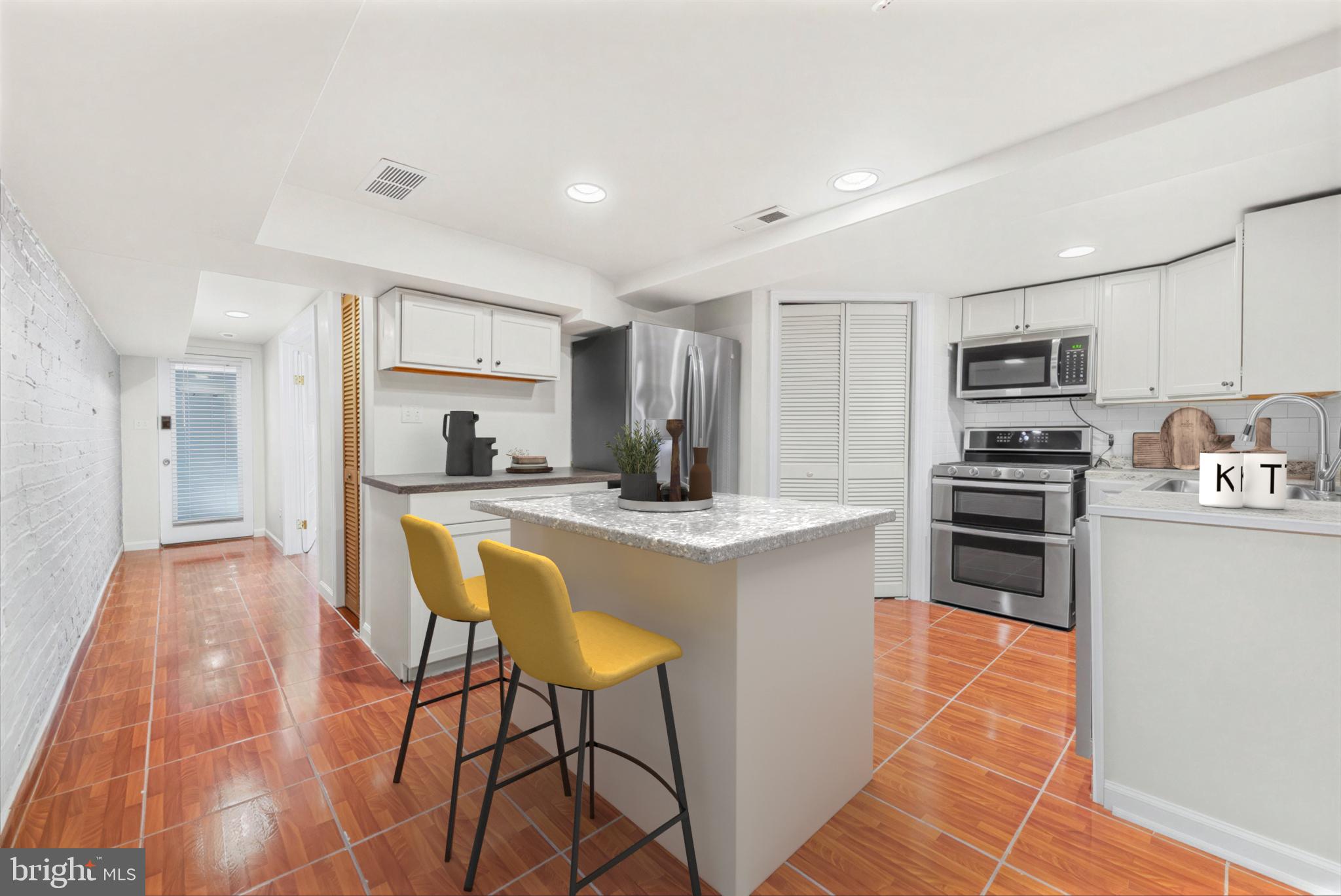 30 R Street Northeast, Unit B Washington, DC 20002 - Photo 10 of 21 a kitchen with stainless steel appliances granite countertop a refrigerator and a stove top oven