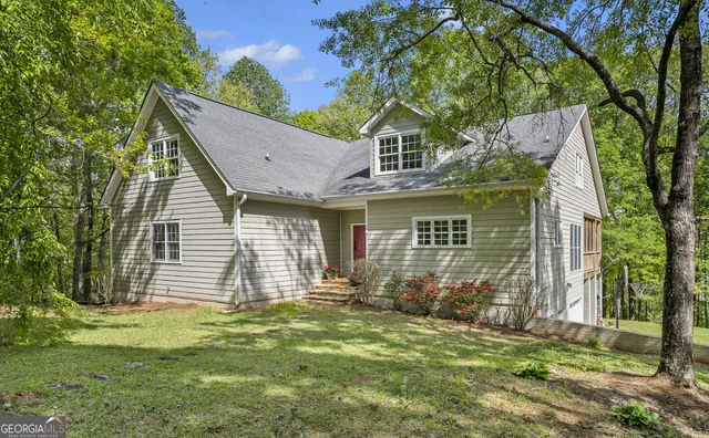 a front view of a house with garden
