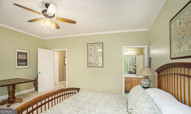 a bathroom with a granite countertop sink a mirror a vanity and shower