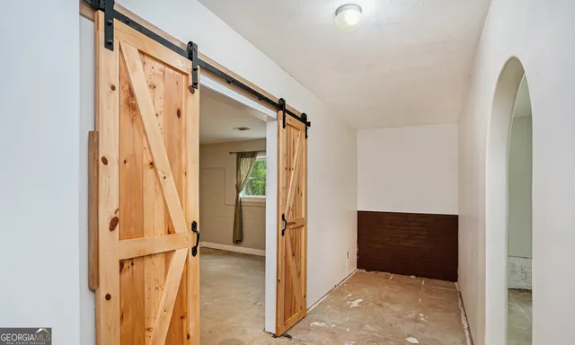a view of an empty room with a balcony