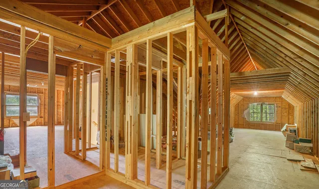 a view of a house with a tree in the background