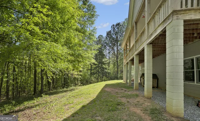 a view of a yard with table and chairs