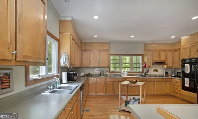 a kitchen with a sink stove and refrigerator