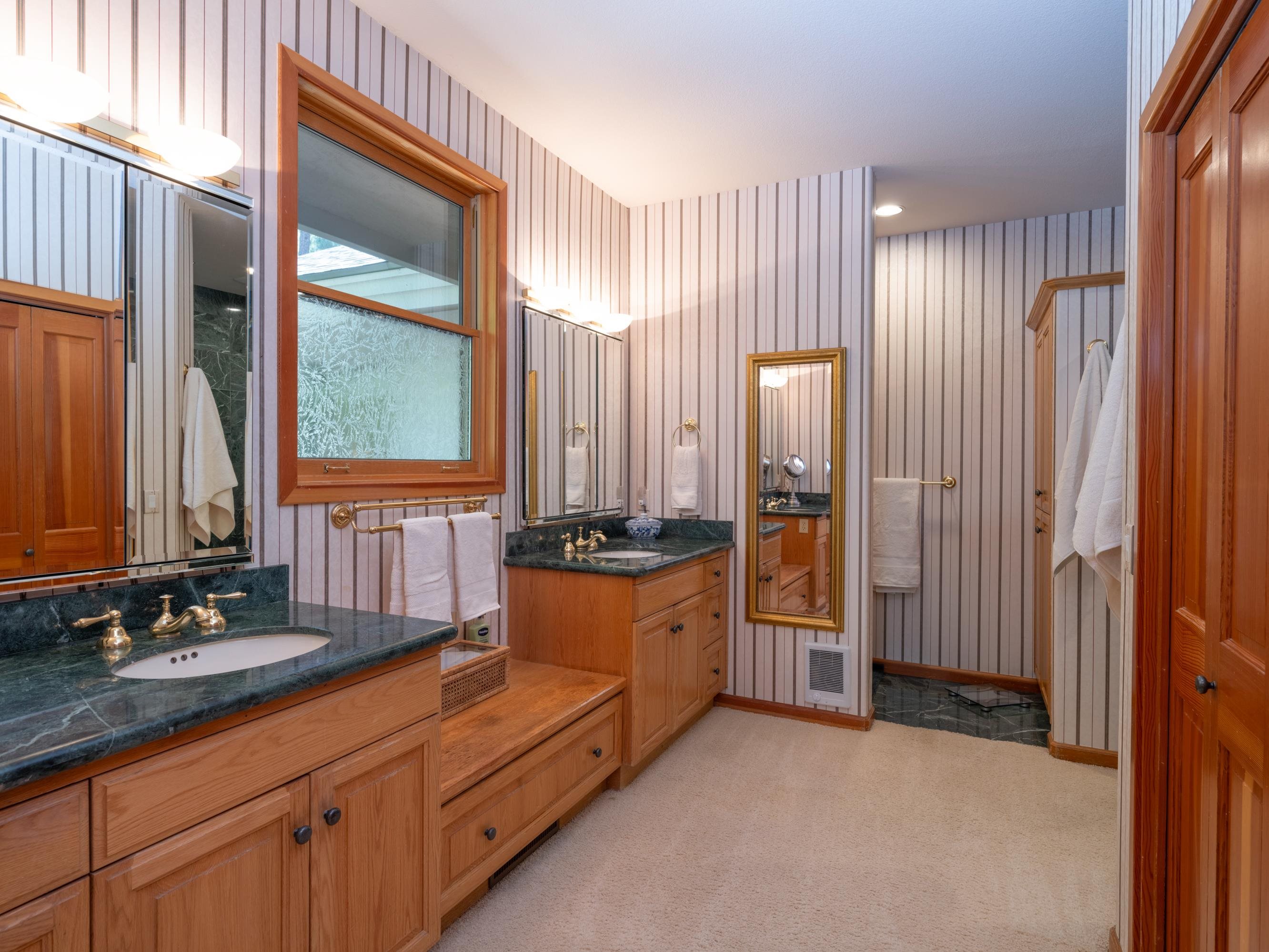 134 Quail View Circle Clio, CA 96106 - Photo 19 of 49 a spacious bathroom with a double vanity sink and a mirror