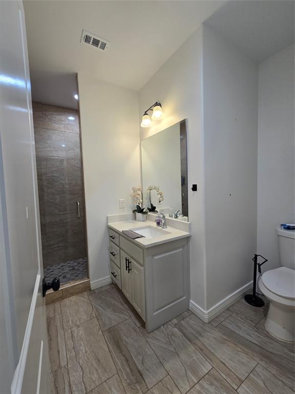 109 Baker Street Mount Vernon, TX 75457 - Photo 18 of 20 a bathroom with a sink and mirror