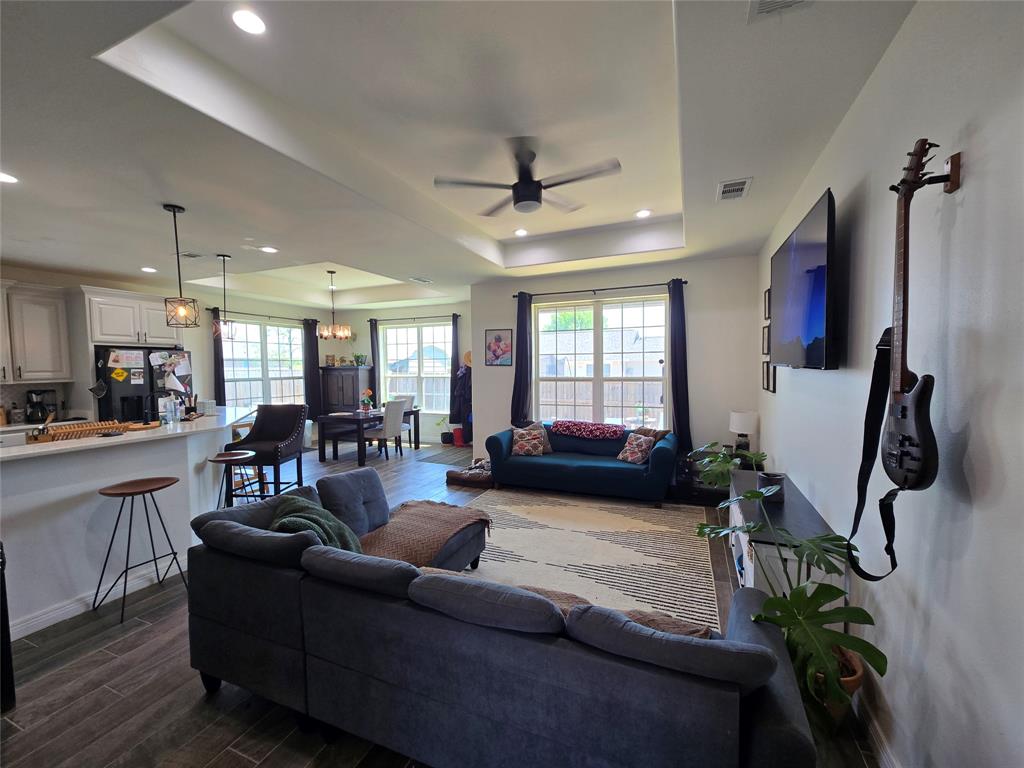 109 Baker Street Mount Vernon, TX 75457 - Photo 3 of 20 a living room with furniture a ceiling fan and a window