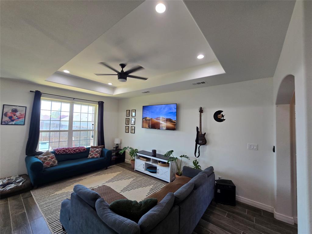 109 Baker Street Mount Vernon, TX 75457 - Photo 4 of 20 a living room with furniture and a flat screen tv