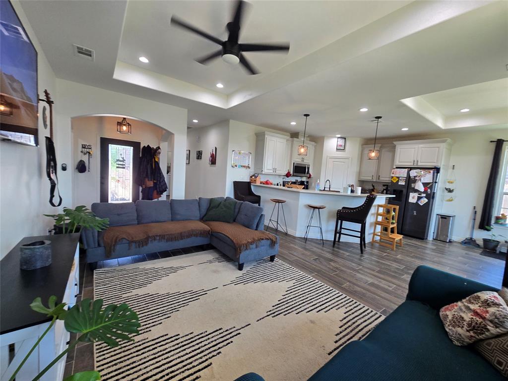 109 Baker Street Mount Vernon, TX 75457 - Photo 5 of 20 a living room with furniture and kitchen view