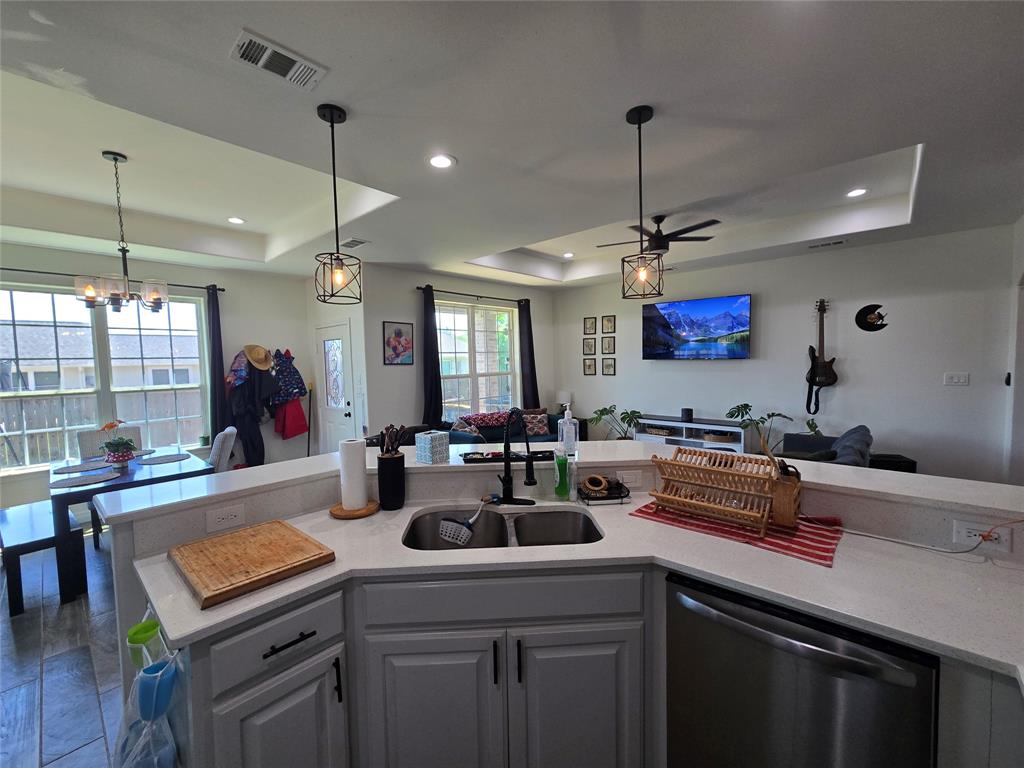 109 Baker Street Mount Vernon, TX 75457 - Photo 10 of 20 a kitchen with a sink a counter space appliances and cabinets