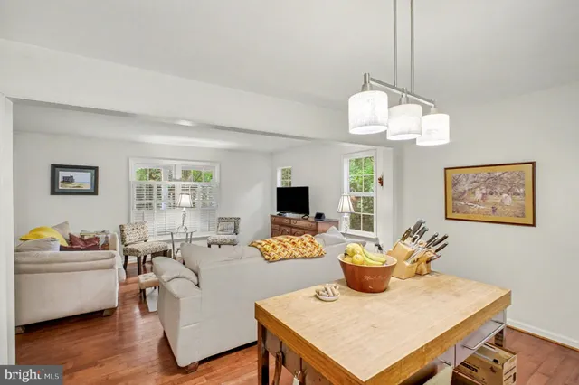 a kitchen with stainless steel appliances granite countertop a stove refrigerator and microwave