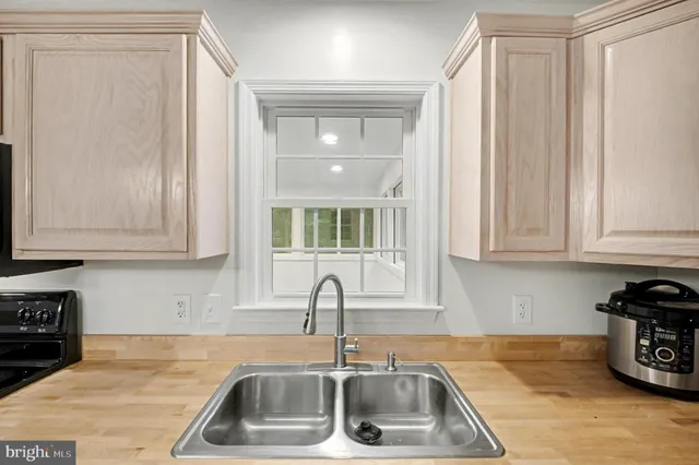 a view of a dining room with furniture and window
