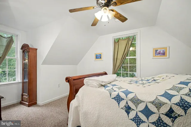 a bedroom with furniture and a window