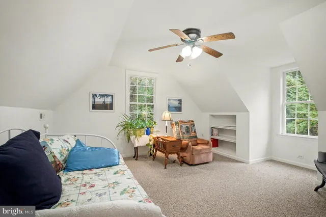 a bathroom with a sink a toilet and a shower curtain