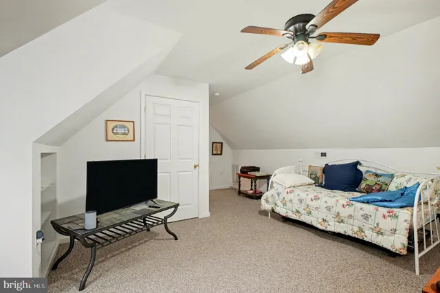 a backyard of a house with a table and chairs