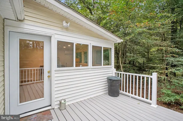an aerial view of a house with a yard and garden