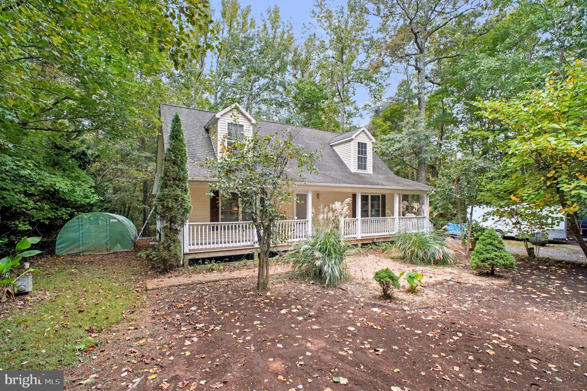 88 Carter Way Montross, VA 22520 - Photo 4 of 68 a front view of a house with a garden