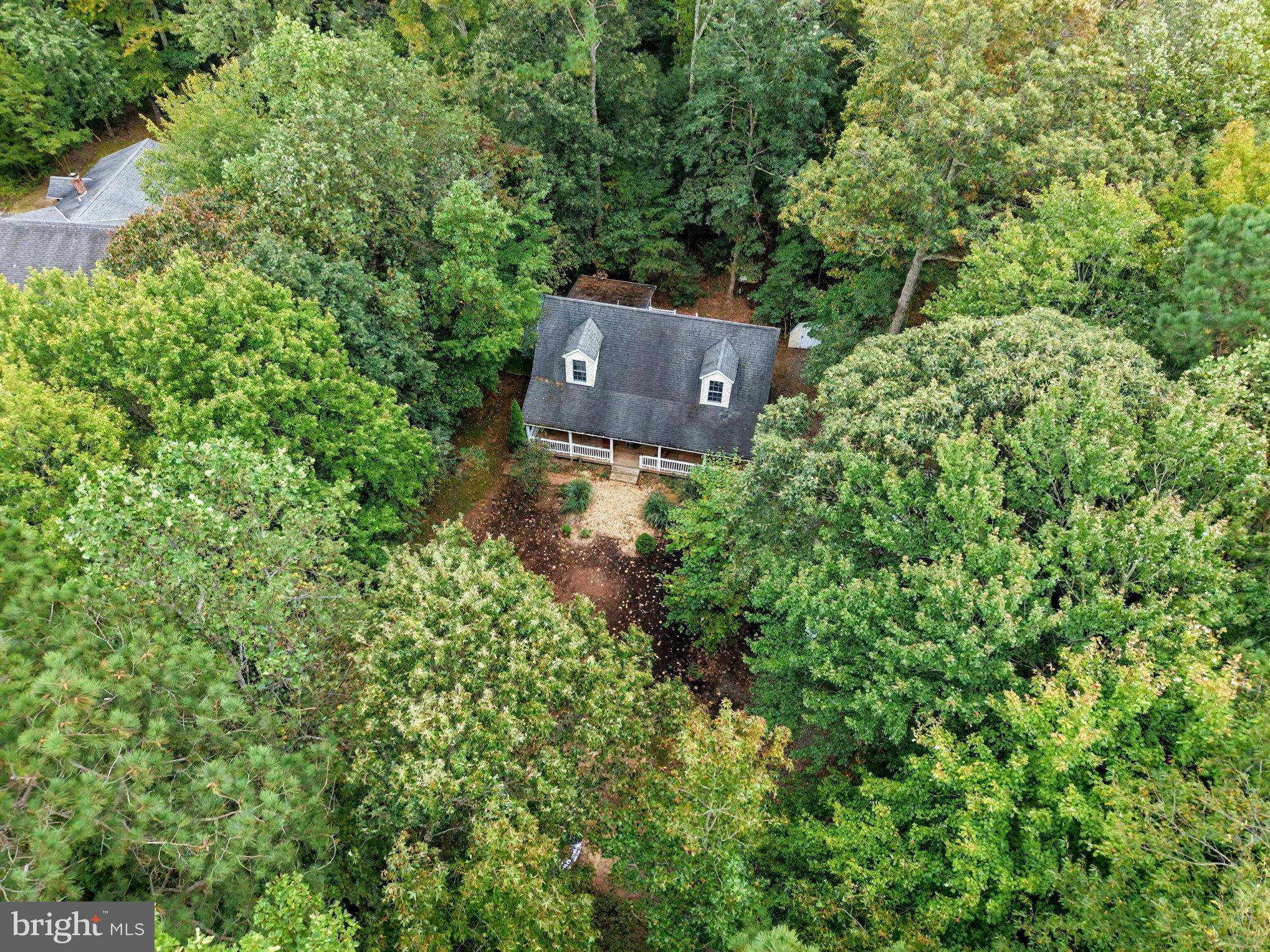 88 Carter Way Montross, VA 22520 - Photo 47 of 68 an aerial view of a house with a yard and tree s