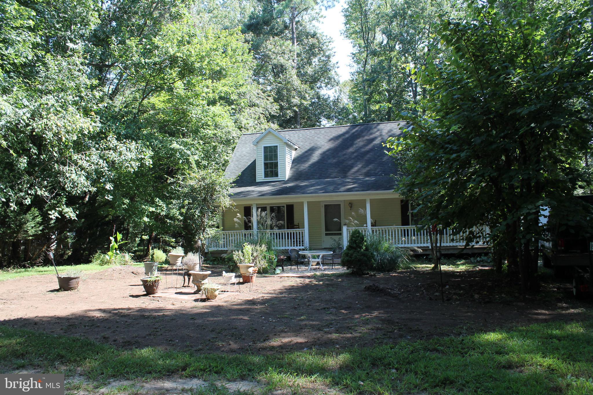 88 Carter Way Montross, VA 22520 - Photo 67 of 68 a front view of a house with garden and sitting area