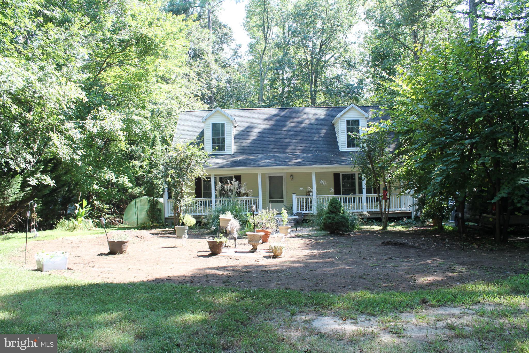 88 Carter Way Montross, VA 22520 - Photo 68 of 68 a front view of a house with garden and sitting area