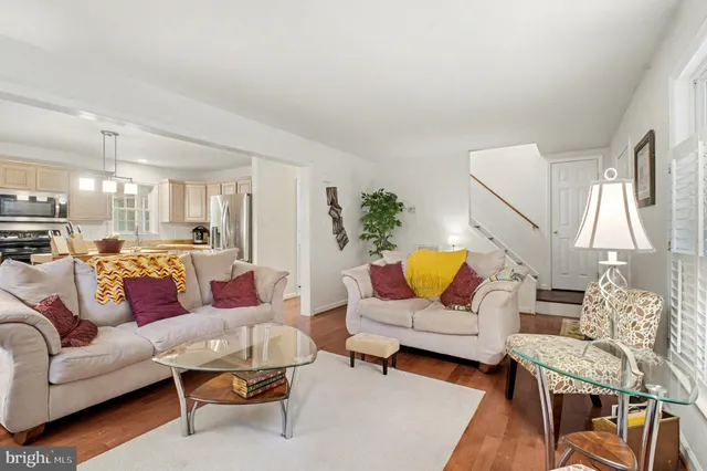 a living room with furniture fireplace and a table