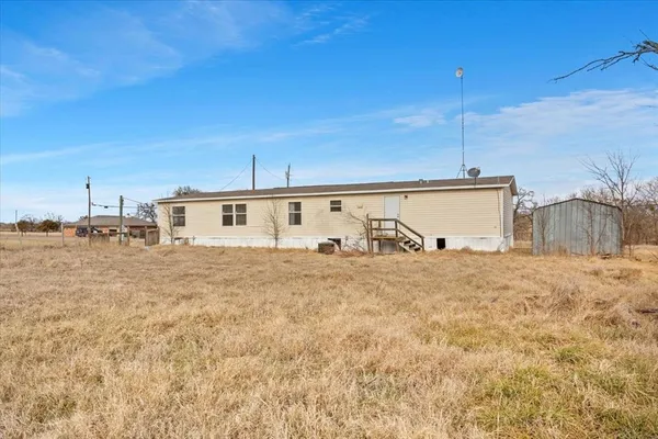 a view of a back yard of the house