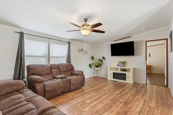 a living room with furniture and a flat screen tv