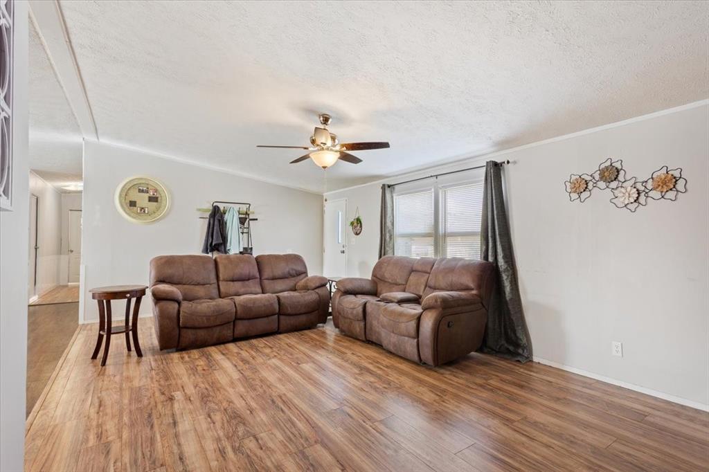 247 North Lake Street Axtell, TX 76624 - Photo 7 of 24 a living room with furniture and wooden floor