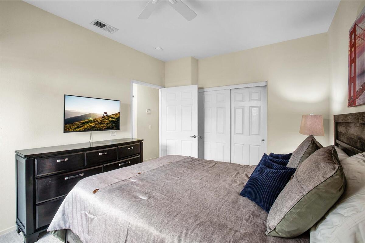 47795 Soft Moonlight La Quinta, CA 92253 - Photo 22 of 44 a bedroom with a bed and a flat screen tv