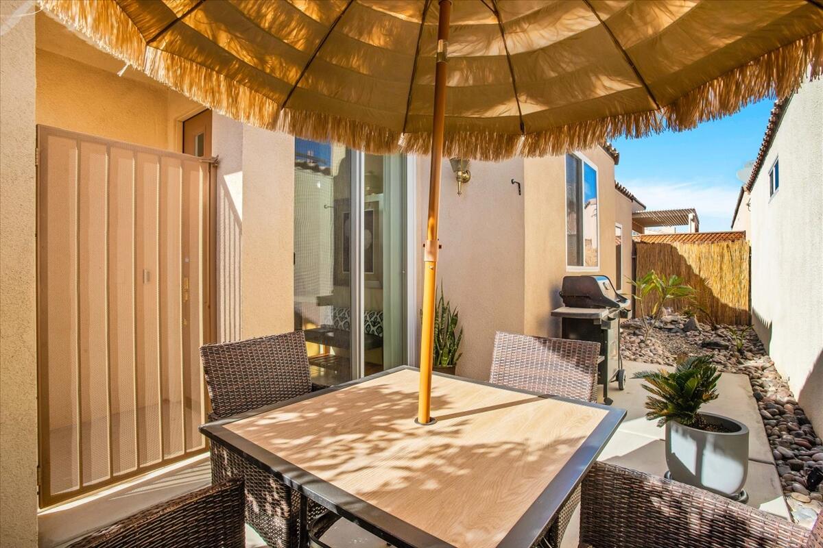 47795 Soft Moonlight La Quinta, CA 92253 - Photo 30 of 44 a dining room with a table and chairs