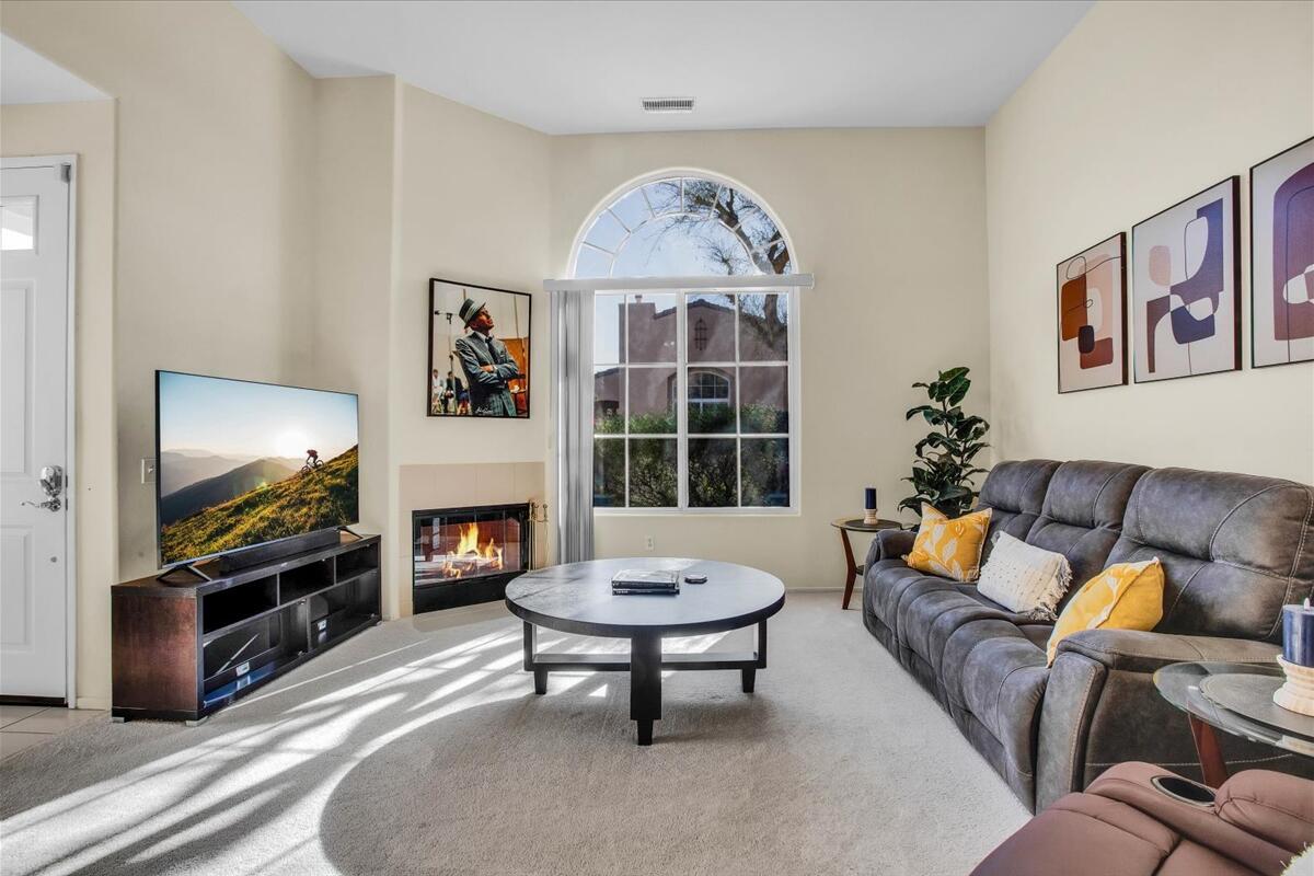 47795 Soft Moonlight La Quinta, CA 92253 - Photo 4 of 44 a living room with furniture a fireplace and a flat screen tv