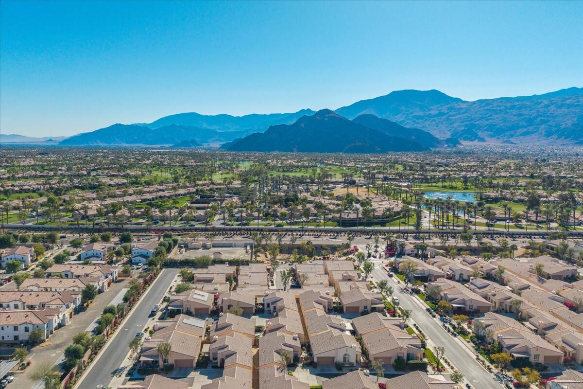 47795 Soft Moonlight La Quinta, CA 92253 - Photo 43 of 44 an aerial view of residential house and sandy dunes
