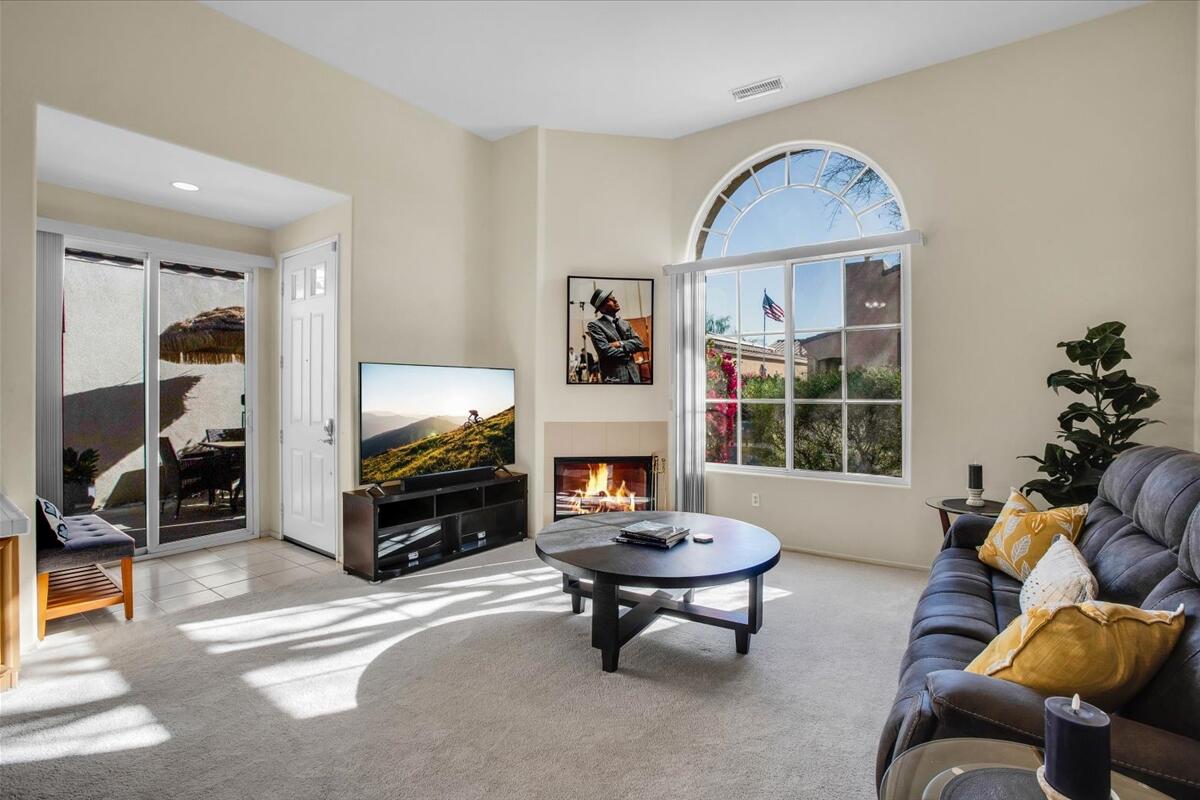 47795 Soft Moonlight La Quinta, CA 92253 - Photo 5 of 44 a living room with furniture and a fireplace