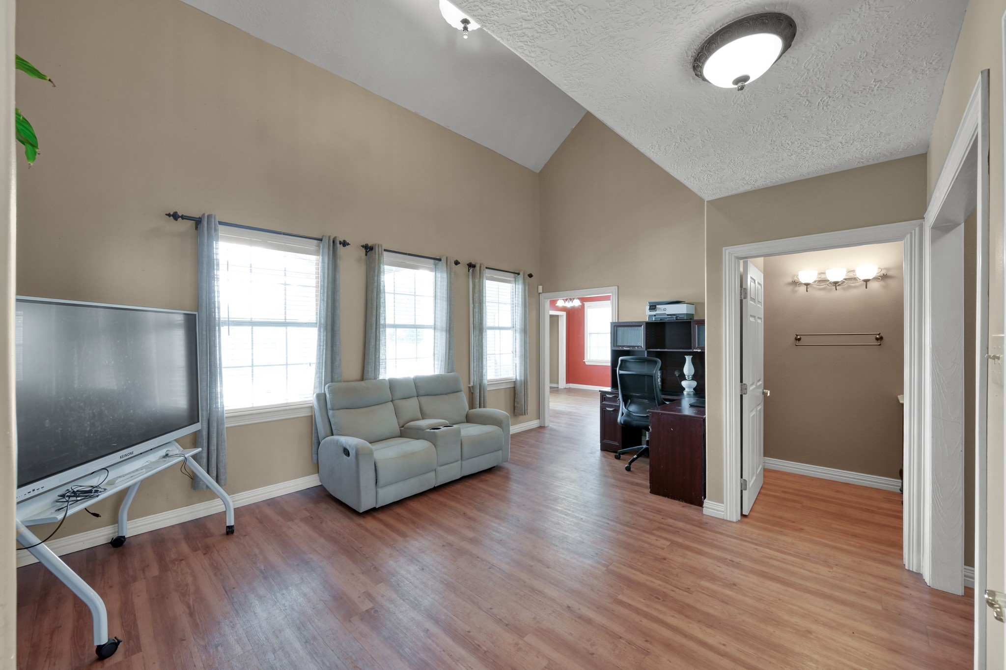 144 Wood Farm Road Huntsville, TX 77320 - Photo 8 of 35 a living room with furniture and a flat screen tv