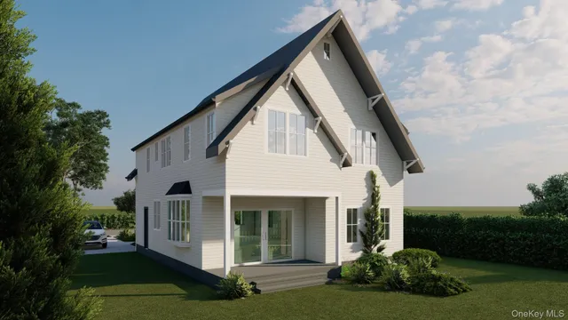 a white building covered with tall trees