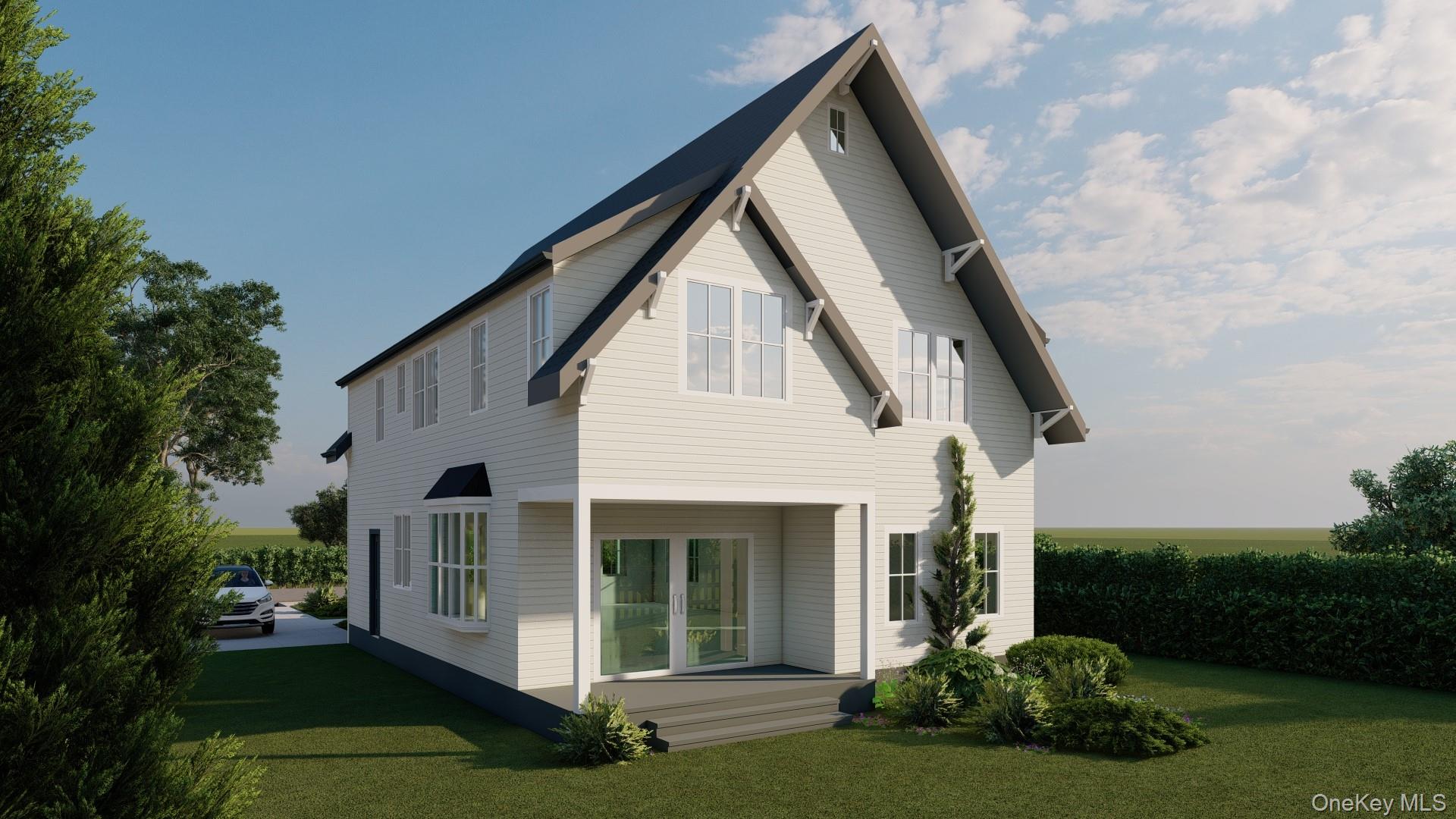 0 Lyman Place Dobbs Ferry, NY 10522 - Photo 5 of 6 a view of a white house next to a yard with plants and trees