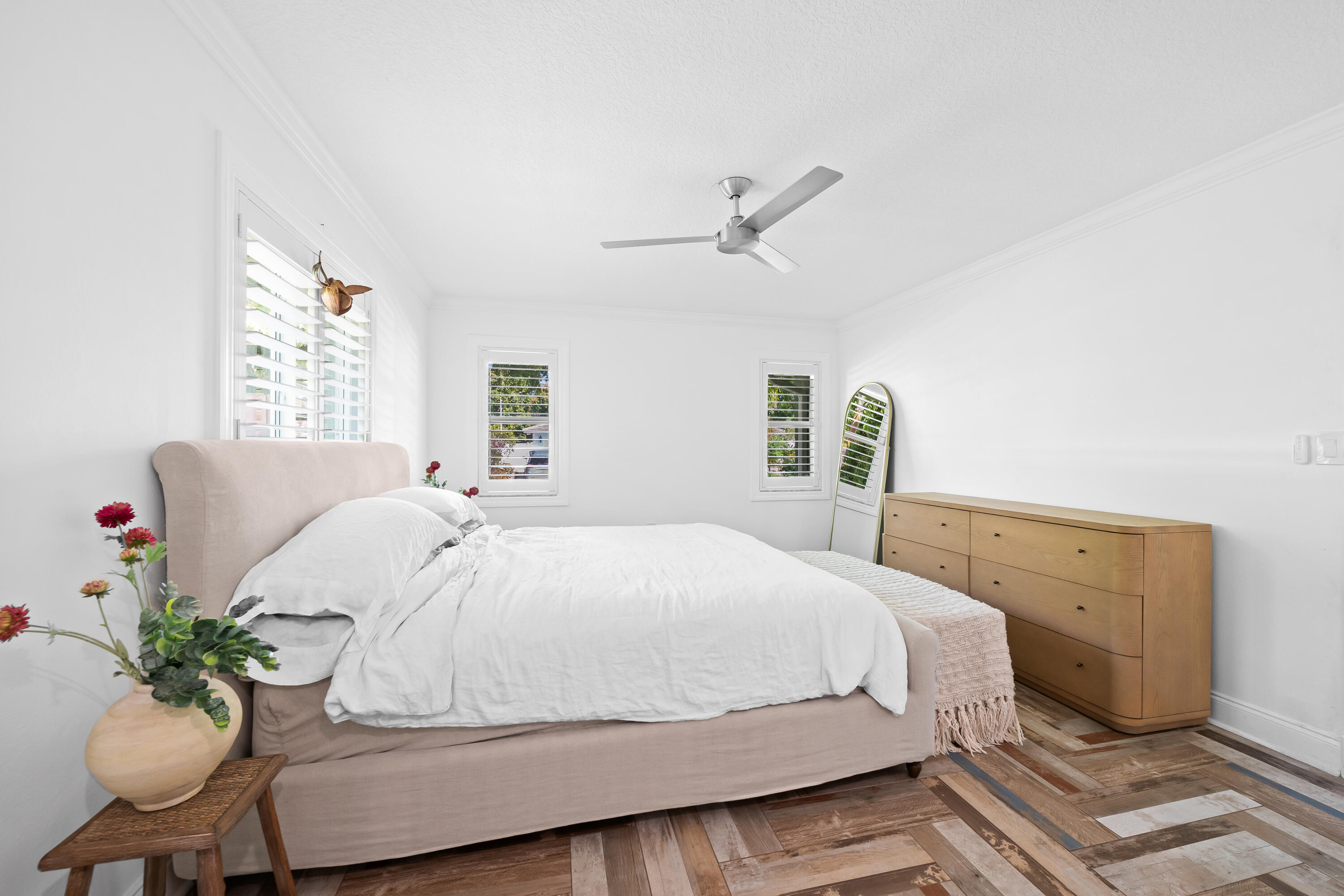 3333 Northwest 26th Court Boca Raton, FL 33434 - Photo 12 of 41 a bedroom with a bed and a chandelier