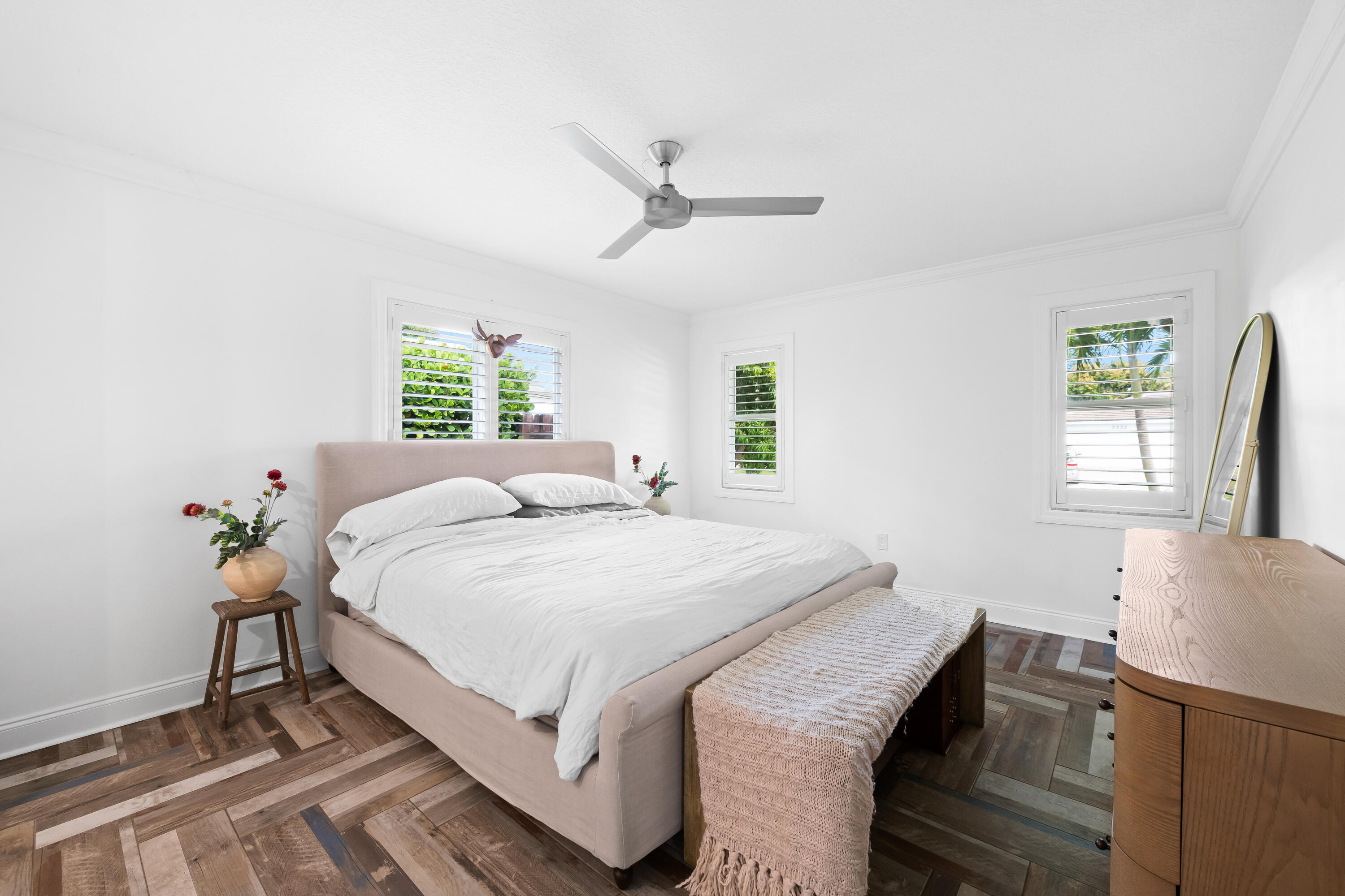 3333 Northwest 26th Court Boca Raton, FL 33434 - Photo 13 of 41 a bed sitting in a bedroom next to a window