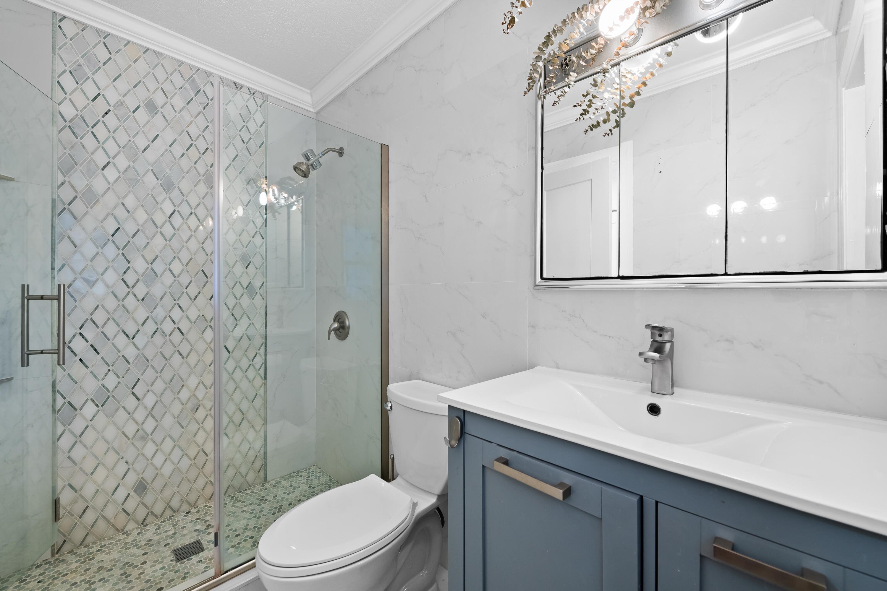 3333 Northwest 26th Court Boca Raton, FL 33434 - Photo 15 of 41 a bathroom with a sink a toilet and shower