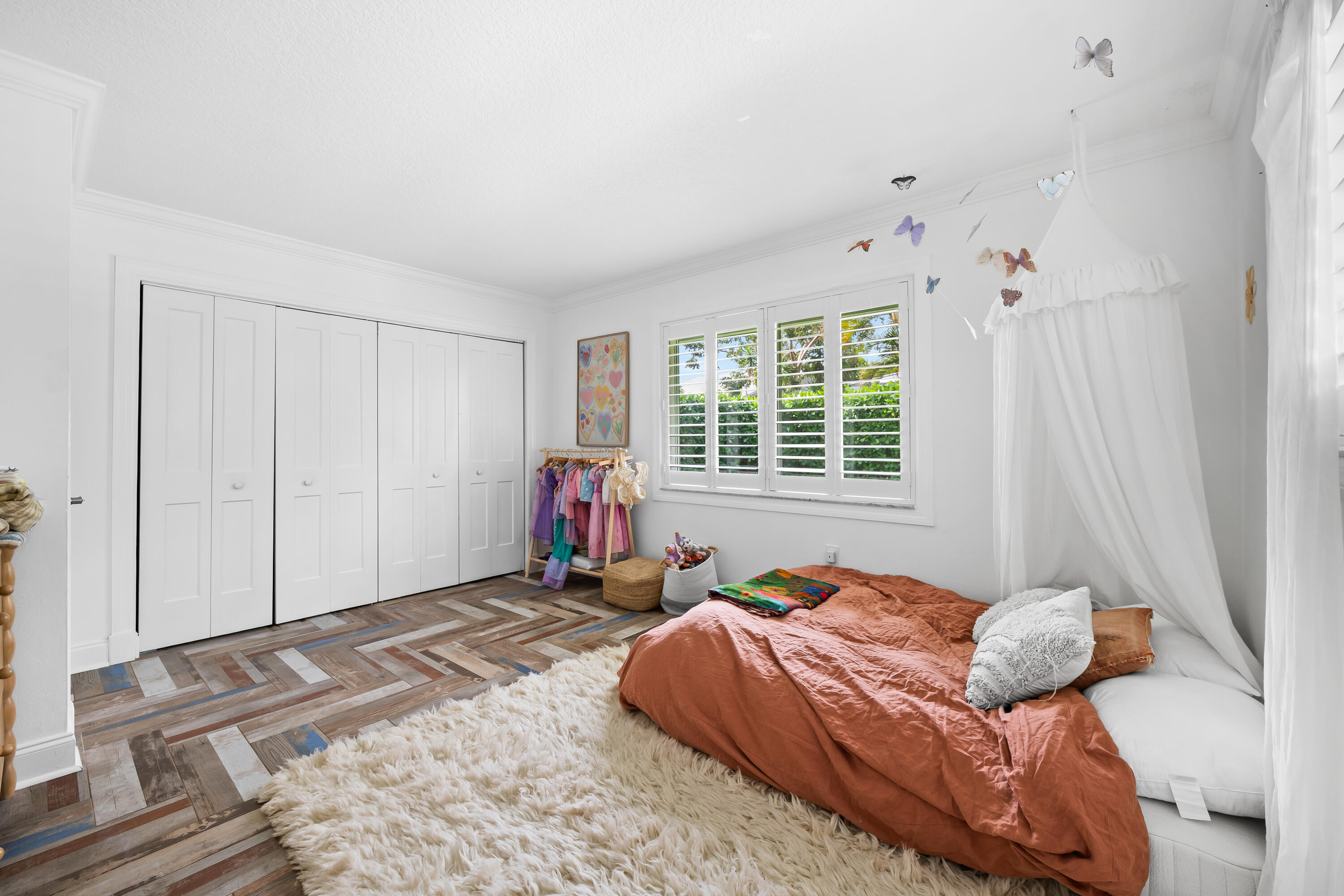 3333 Northwest 26th Court Boca Raton, FL 33434 - Photo 18 of 41 a bed sitting in a bedroom next to a window