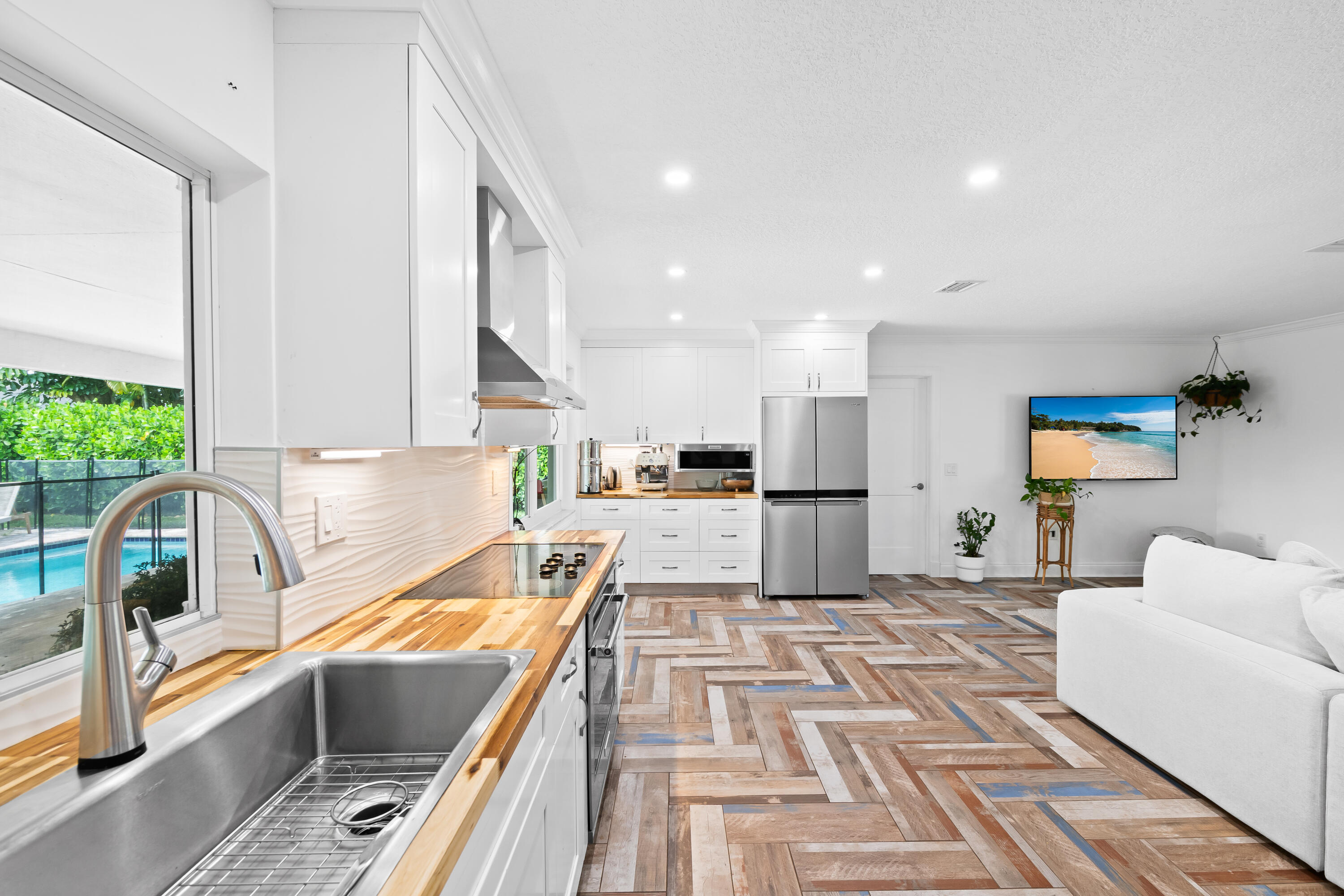 3333 Northwest 26th Court Boca Raton, FL 33434 - Photo 2 of 41 a kitchen with a sink appliances and cabinets