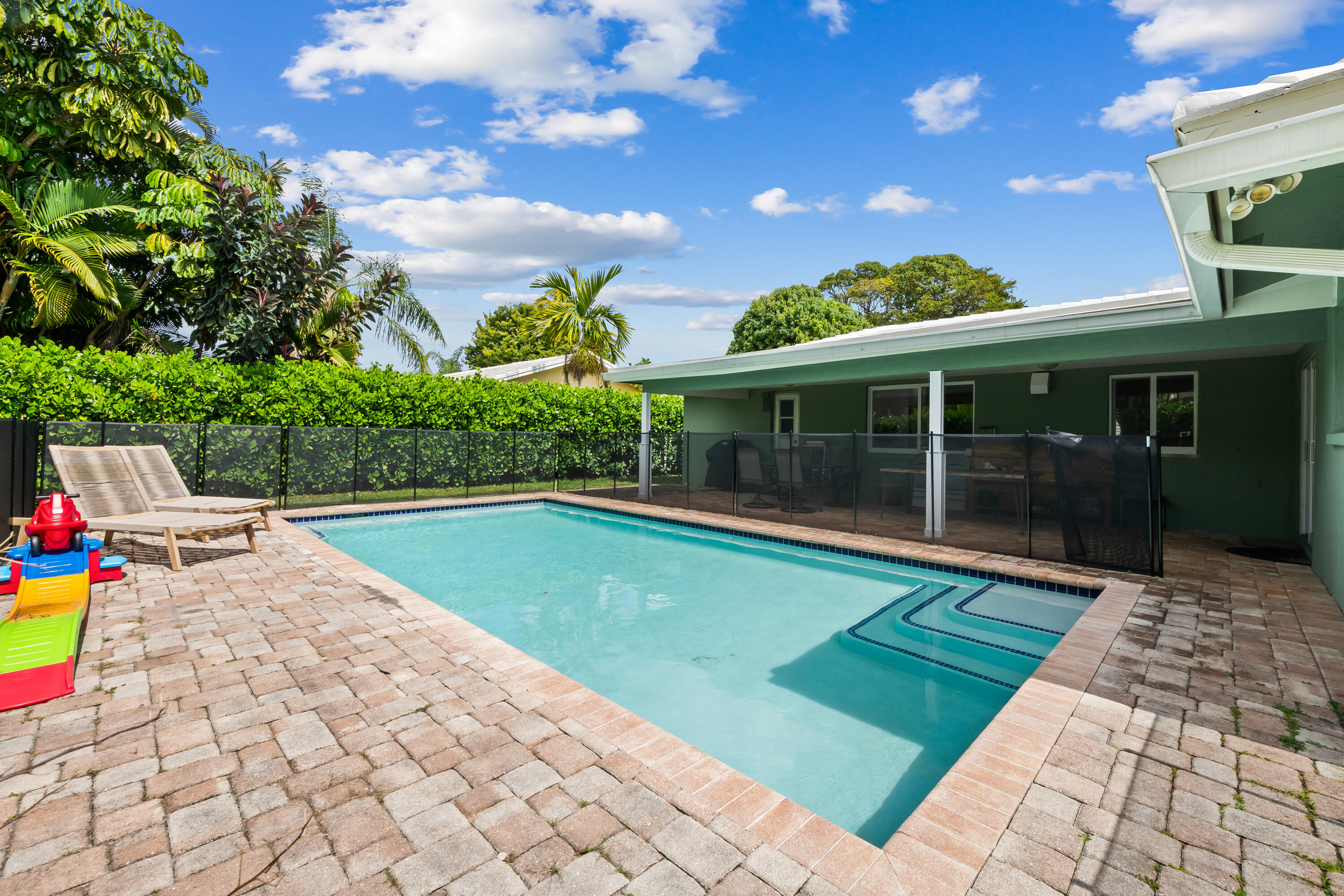 3333 Northwest 26th Court Boca Raton, FL 33434 - Photo 25 of 41 a view of swimming pool with a patio