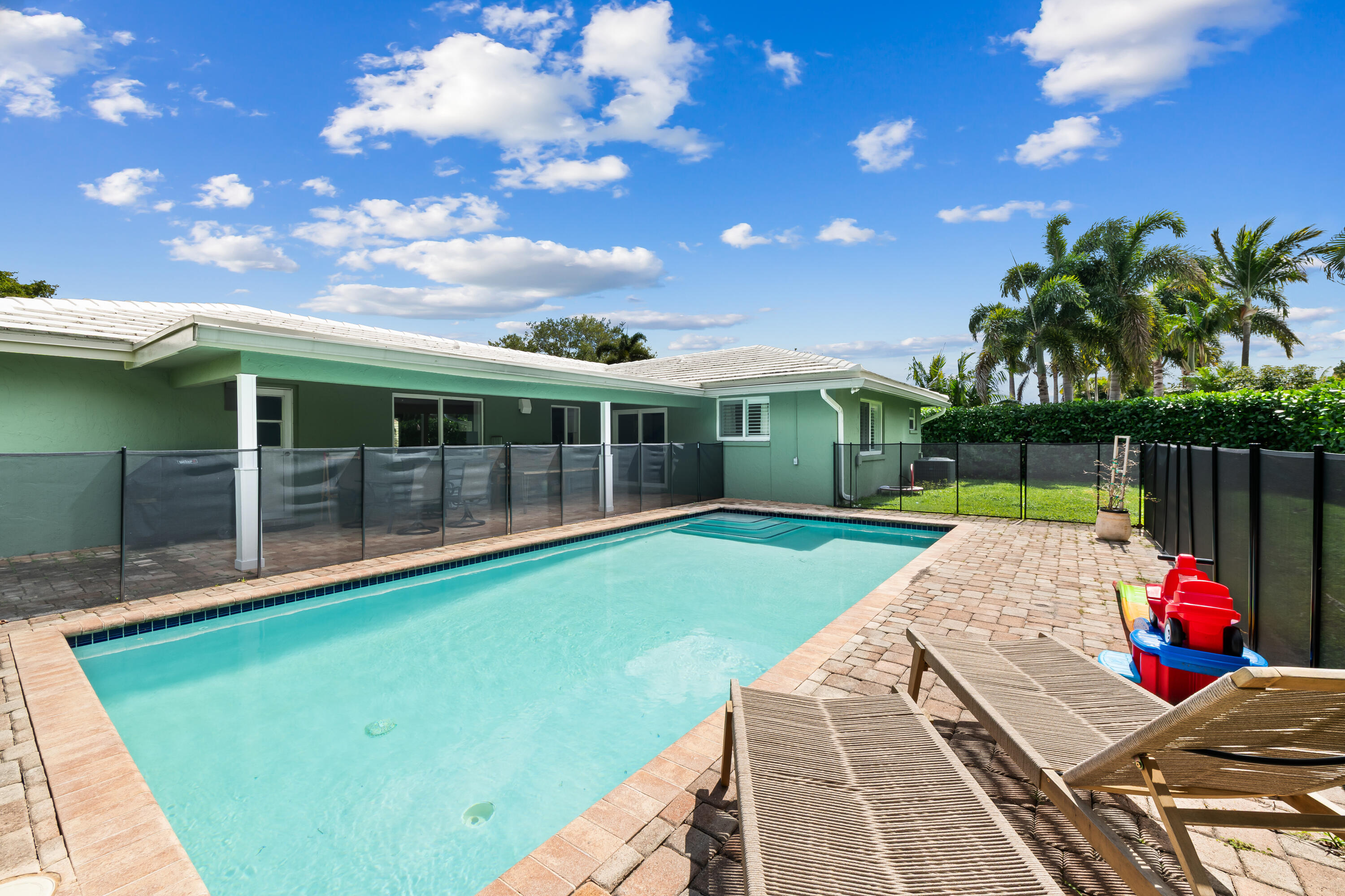 3333 Northwest 26th Court Boca Raton, FL 33434 - Photo 26 of 41 a view of a house with backyard porch and sitting area