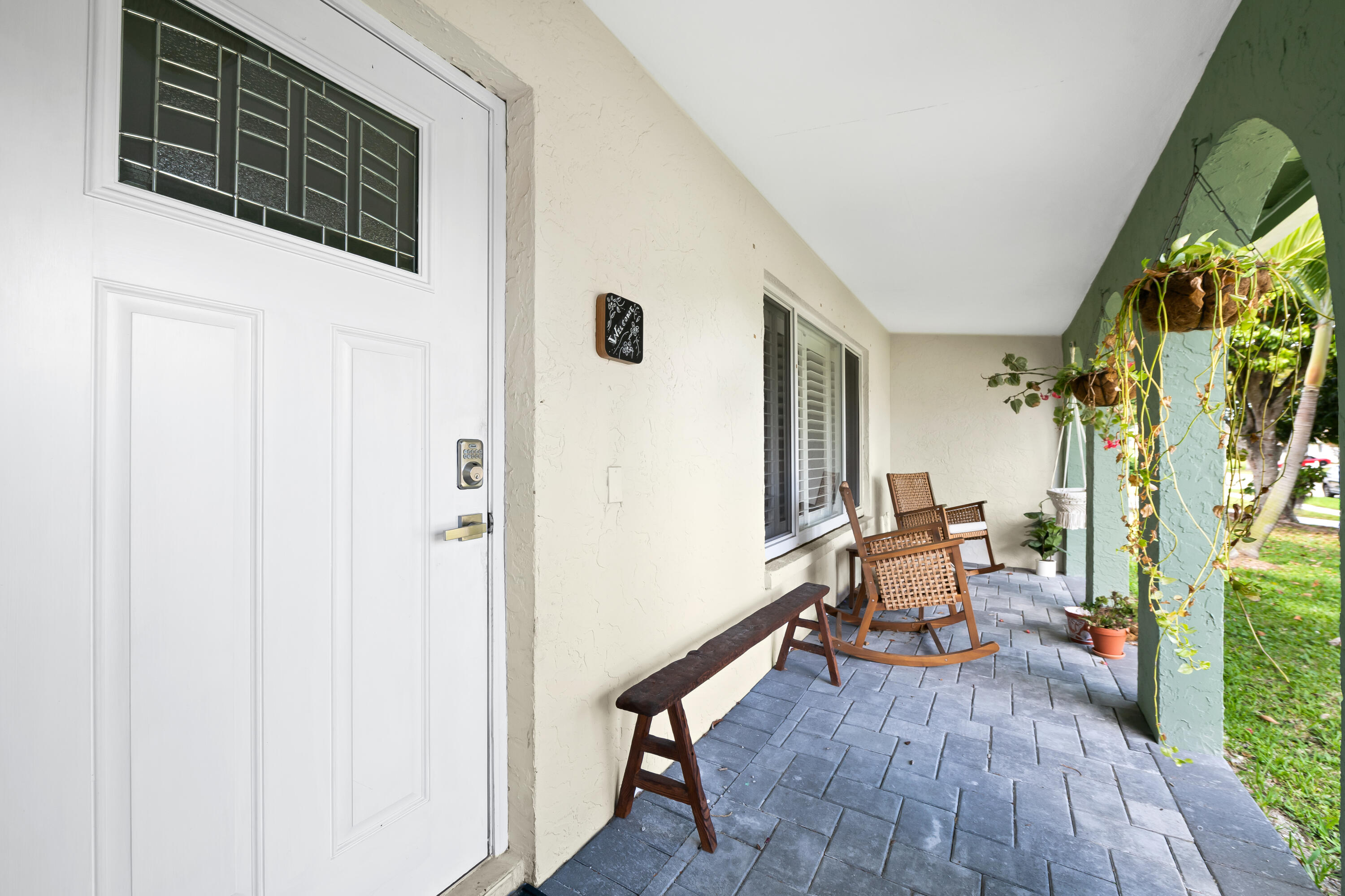 3333 Northwest 26th Court Boca Raton, FL 33434 - Photo 28 of 41 a view of a hallway with wooden floor and furniture