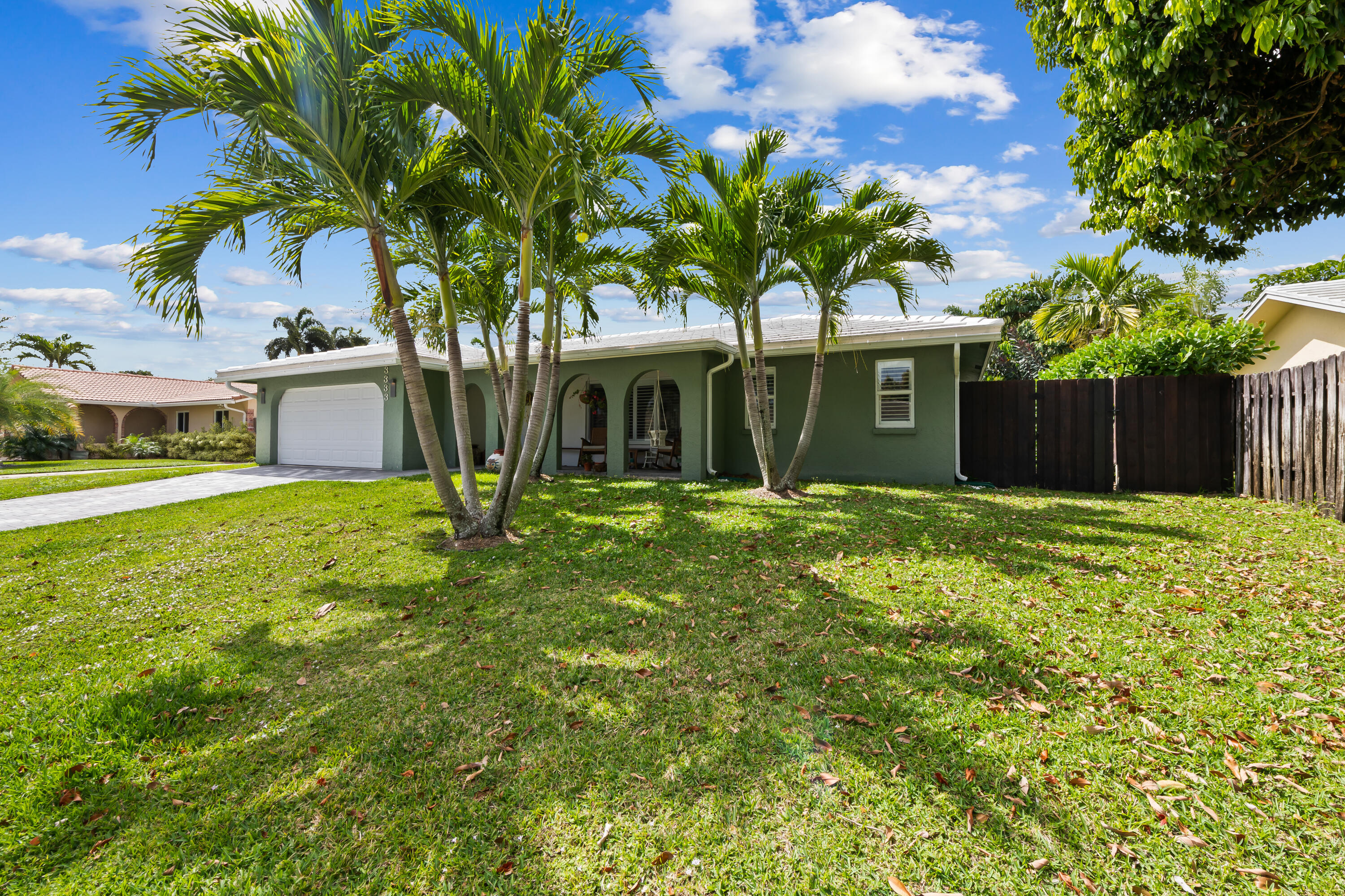 3333 Northwest 26th Court Boca Raton, FL 33434 - Photo 32 of 41 a front view of a house with garden