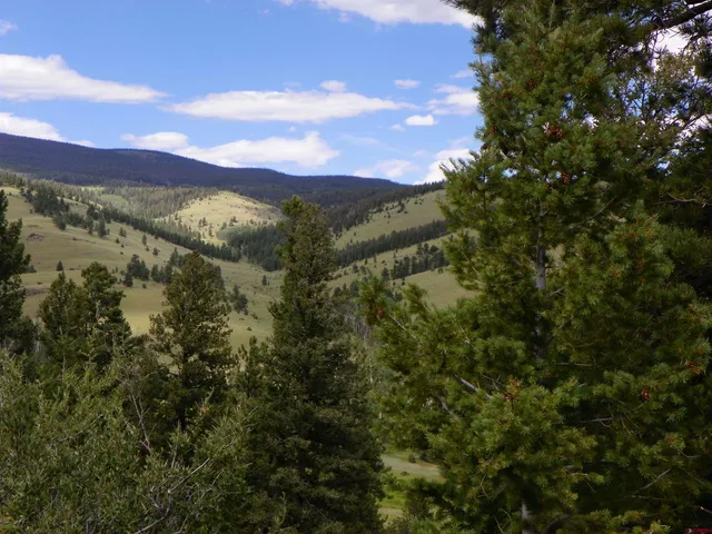 a view of a city with mountains in the background