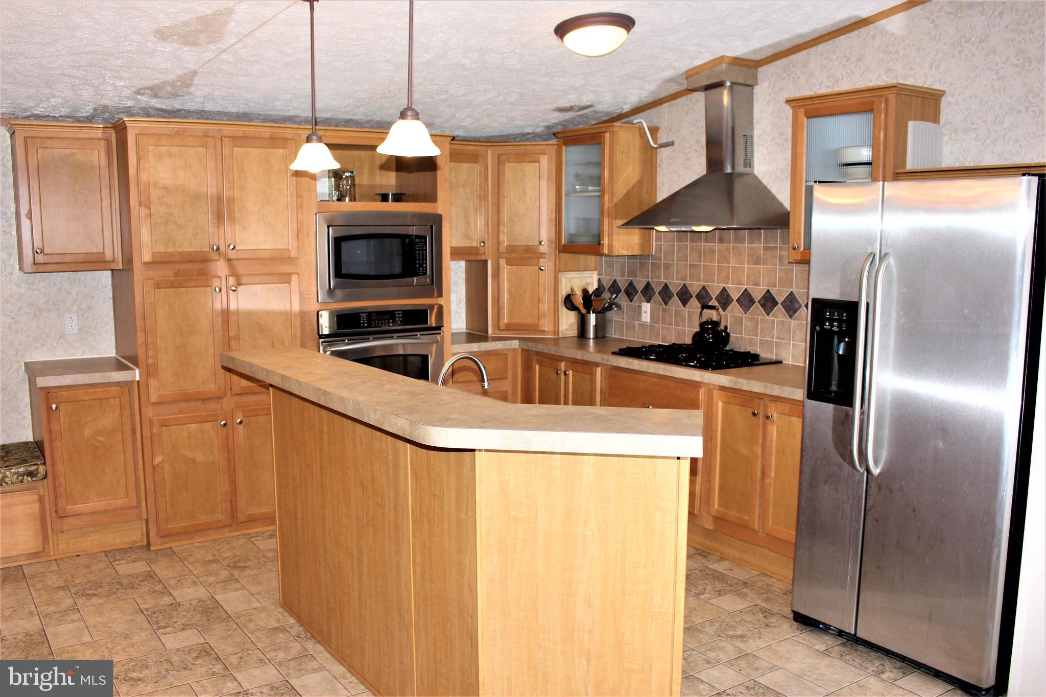28288 Basin Road Millsboro, DE 19966 - Photo 12 of 38 Kitchen with breakfast bar.