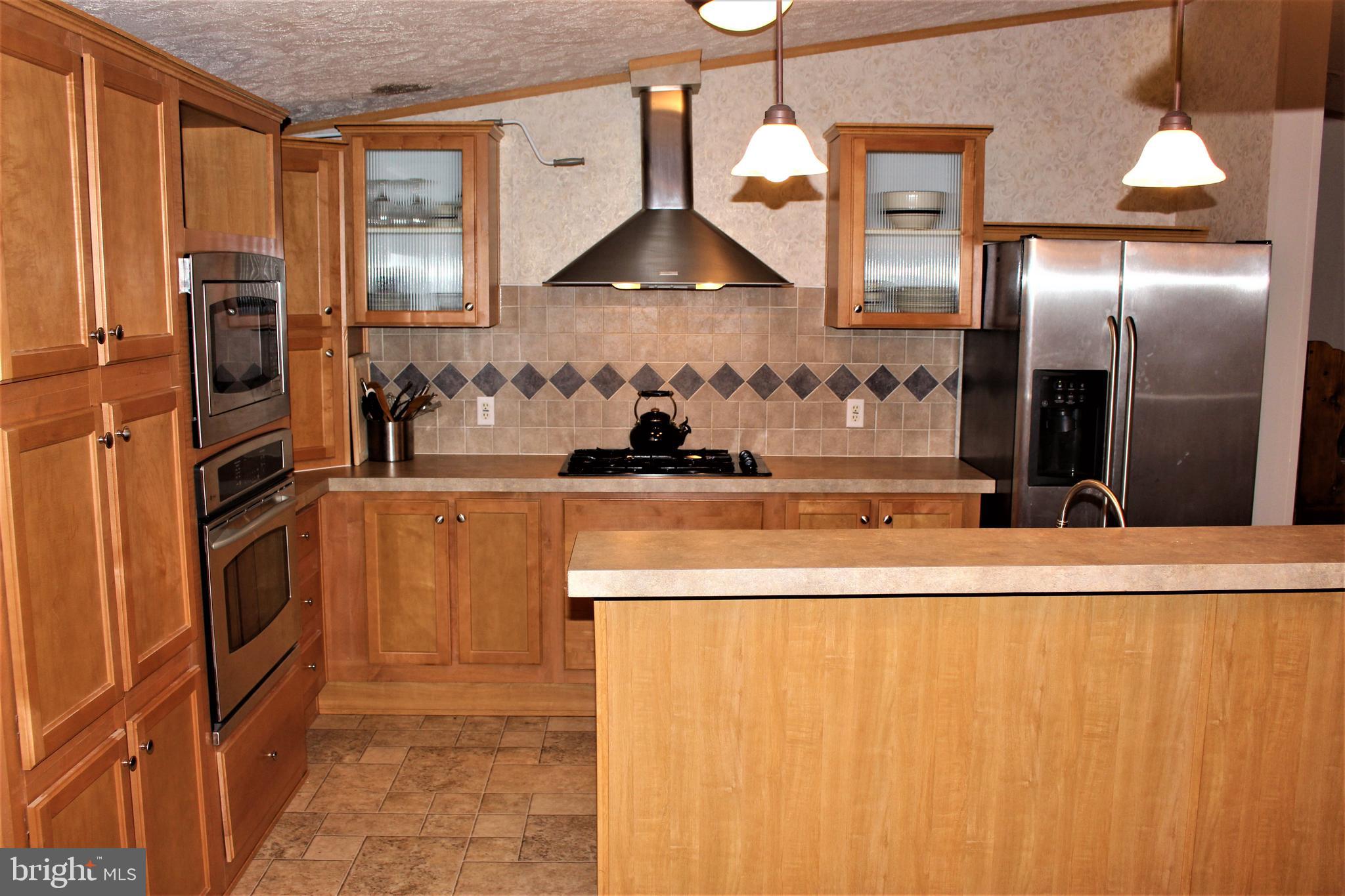 28288 Basin Road Millsboro, DE 19966 - Photo 13 of 38 GE Profile series appliances, Maple cabinets.